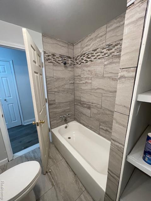 19961 Forrer St, Detroit, MI 48235 - full bath featuring shower / washtub combination, toilet, and marble finish floors