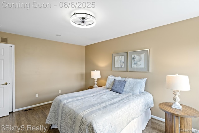 20605 Hickory St, Woodhaven, MI 48183 - bedroom featuring wood finished floors and baseboards