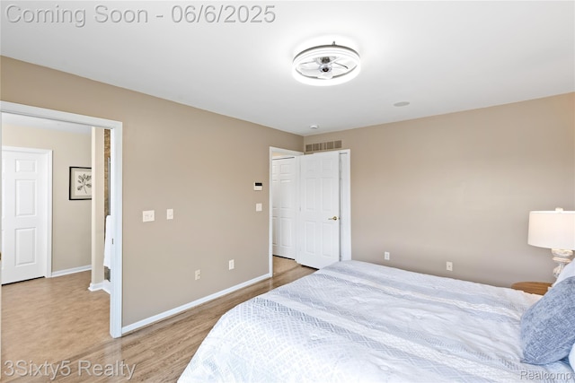 20605 Hickory St, Woodhaven, MI 48183 - bedroom featuring baseboards and wood finished floors