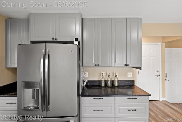 20605 Hickory St, Woodhaven, MI 48183 - kitchen with stainless steel refrigerator with ice dispenser and light wood finished floors
