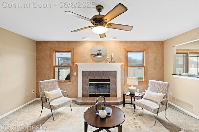 20605 Hickory St, Woodhaven, MI 48183 - living area with a ceiling fan, healthy amount of natural light, baseboards, and a tile fireplace