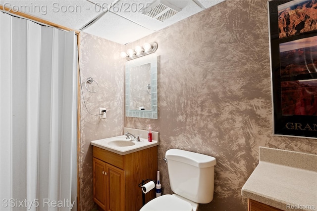 20605 Hickory St, Woodhaven, MI 48183 - bathroom with vanity, toilet, and wallpapered walls