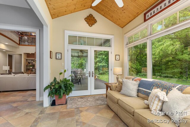 1020 E Woodlawn Ave, Hastings, MI 49058 - living room with a ceiling fan, french doors, wooden ceiling, high vaulted ceiling, and stone finish flooring