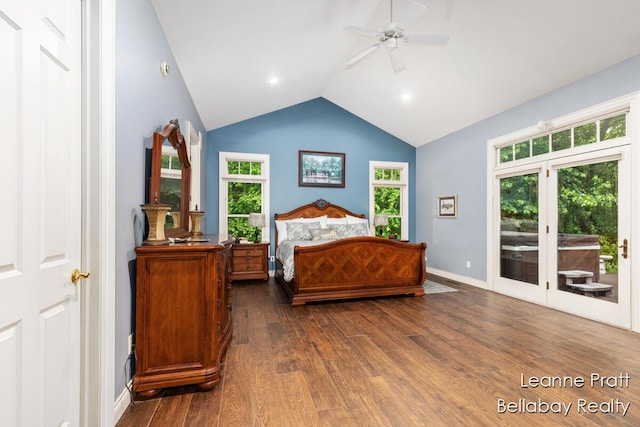 1020 E Woodlawn Ave, Hastings, MI 49058 - bedroom with access to exterior, dark wood-style floors, baseboards, a ceiling fan, and high vaulted ceiling
