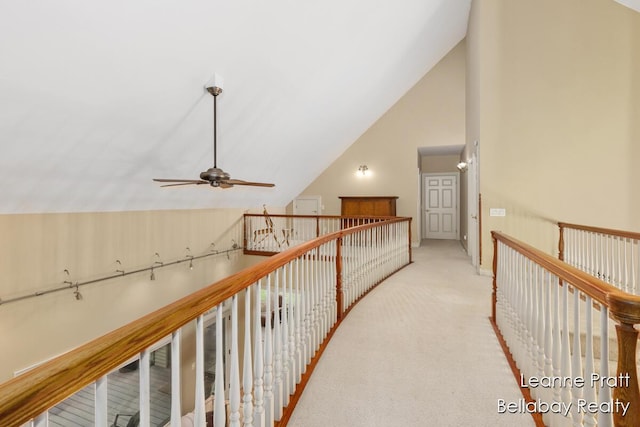 1020 E Woodlawn Ave, Hastings, MI 49058 - hallway featuring carpet floors, an upstairs landing, and high vaulted ceiling