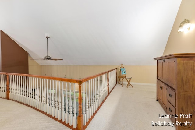 1020 E Woodlawn Ave, Hastings, MI 49058 - hallway with light carpet, lofted ceiling, and baseboards