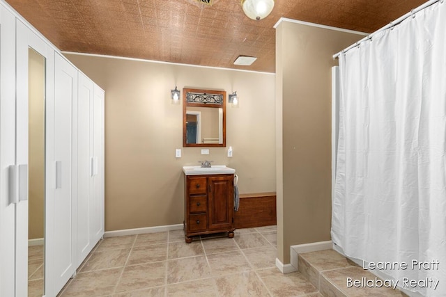 1020 E Woodlawn Ave, Hastings, MI 49058 - bathroom with vanity and baseboards