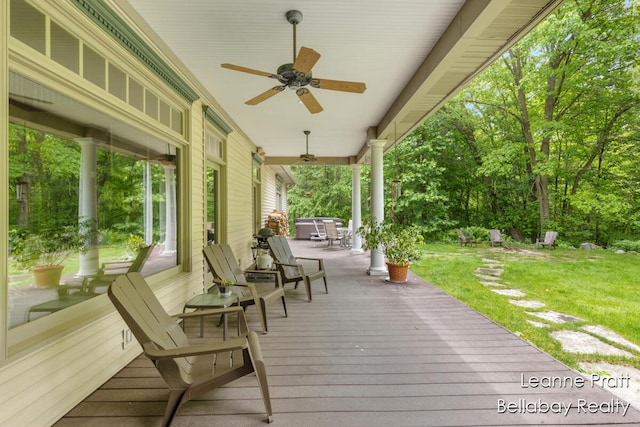1020 E Woodlawn Ave, Hastings, MI 49058 - wooden terrace with a ceiling fan and a yard