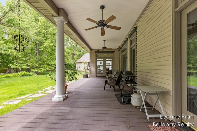 1020 E Woodlawn Ave, Hastings, MI 49058 - deck with a lawn, ceiling fan, and french doors