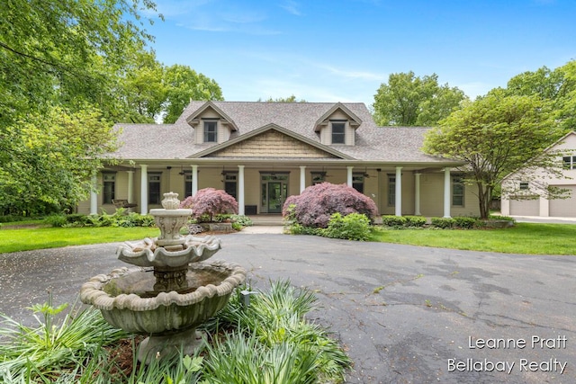 1020 E Woodlawn Ave, Hastings, MI 49058 - cape cod-style house with a porch and roof with shingles
