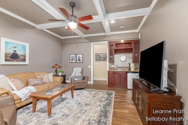 1020 E Woodlawn Ave, Hastings, MI 49058 - living area featuring light wood-style floors, a ceiling fan, coffered ceiling, beam ceiling, and baseboards