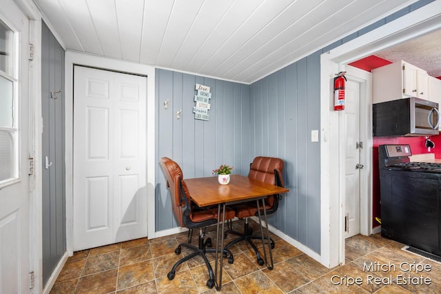 772 26th St SW, Wyoming, MI 49509 - dining area with baseboards and wooden ceiling