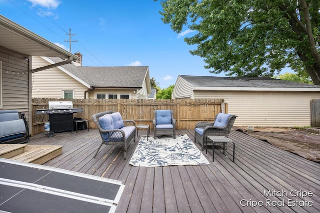 772 26th St SW, Wyoming, MI 49509 - deck featuring area for grilling and an outdoor living space