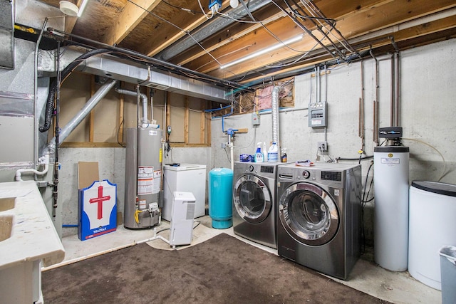 4273 20th St, Dorr, MI 49323 - unfinished below grade area with independent washer and dryer, a water softener system, gas water heater, and a water pressure tank