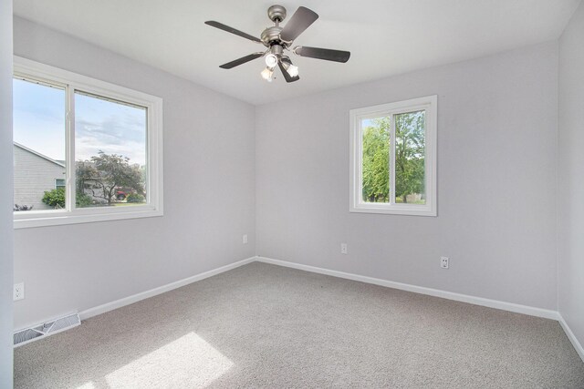 4273 20th St, Dorr, MI 49323 - carpeted spare room with baseboards and ceiling fan