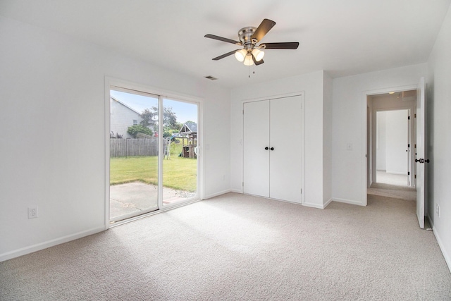 4273 20th St, Dorr, MI 49323 - unfurnished bedroom with access to exterior, light colored carpet, baseboards, and a closet
