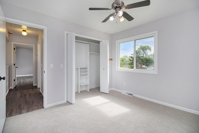 4273 20th St, Dorr, MI 49323 - unfurnished bedroom featuring carpet, baseboards, a closet, and a ceiling fan