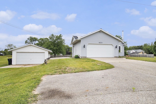 4273 20th St, Dorr, MI 49323 - view of side of property featuring an outbuilding and a garage