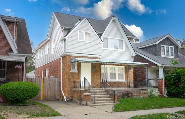 15859 Cloverlawn St, Detroit, MI 48238 - view of front facade featuring brick siding and covered porch