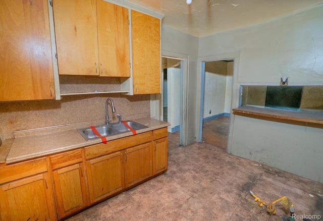 15859 Cloverlawn St, Detroit, MI 48238 - kitchen with backsplash, light countertops, and brown cabinetry