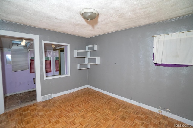 15859 Cloverlawn St, Detroit, MI 48238 - empty room with a textured ceiling and baseboards