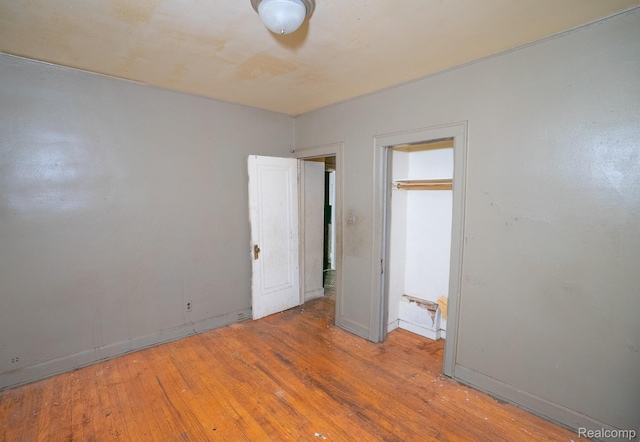 15859 Cloverlawn St, Detroit, MI 48238 - unfurnished bedroom with hardwood / wood-style flooring and baseboards