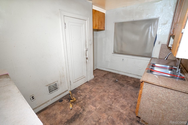 15859 Cloverlawn St, Detroit, MI 48238 - kitchen featuring tile patterned floors, brown cabinets, and light countertops