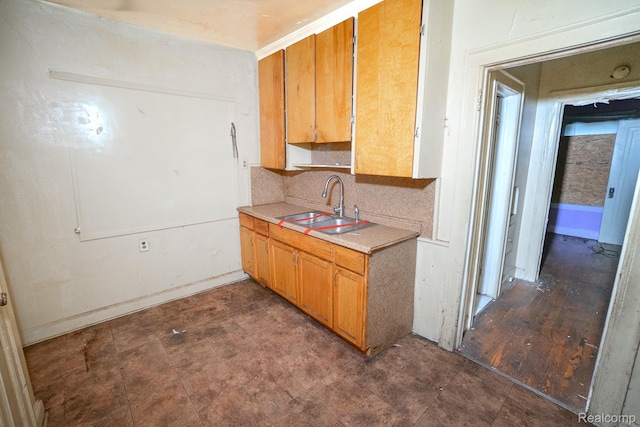 15859 Cloverlawn St, Detroit, MI 48238 - kitchen featuring light countertops, brown cabinets, and tasteful backsplash