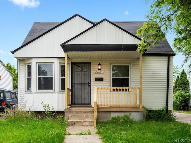 20834 Eastwood Blvd, Warren, MI 48089 - bungalow-style home with roof with shingles and a porch