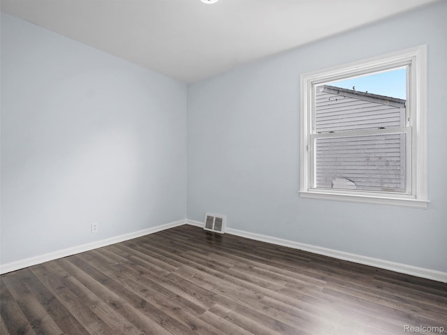 20834 Eastwood Blvd, Warren, MI 48089 - spare room featuring baseboards and dark wood finished floors