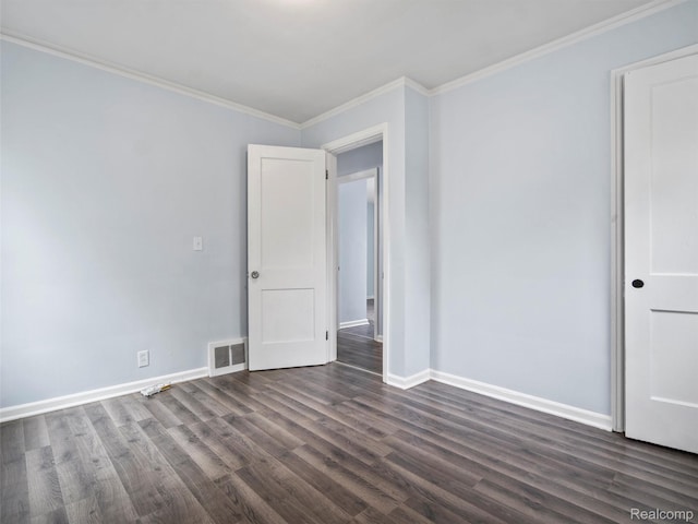 20834 Eastwood Blvd, Warren, MI 48089 - spare room with dark wood-style floors, baseboards, and crown molding