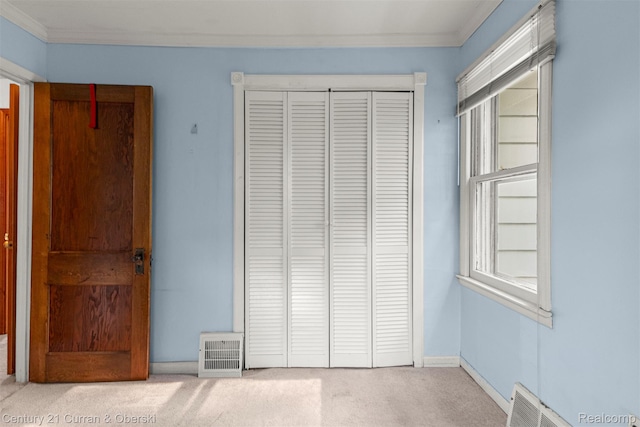 2143 Boldt St, Dearborn, MI 48124 - unfurnished bedroom with carpet floors, crown molding, a closet, and baseboards