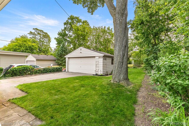 2143 Boldt St, Dearborn, MI 48124 - view of green lawn with a detached garage and an outbuilding