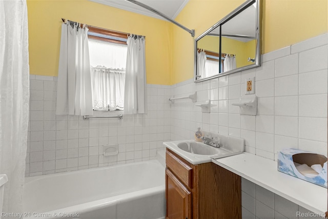 2143 Boldt St, Dearborn, MI 48124 - bathroom featuring vanity, tile walls, a wainscoted wall, ornamental molding, and shower / bath combo