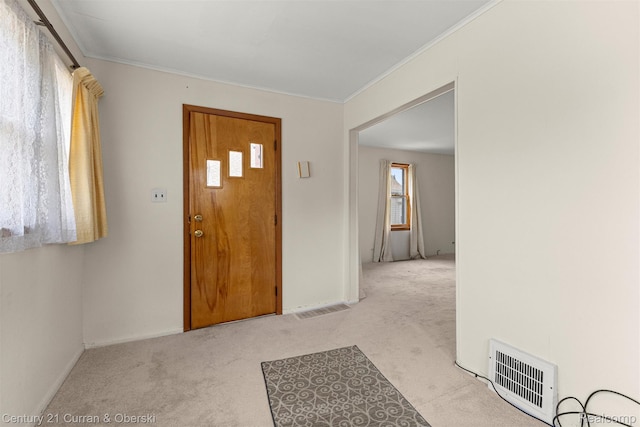 2143 Boldt St, Dearborn, MI 48124 - foyer entrance featuring light colored carpet, baseboards, and ornamental molding