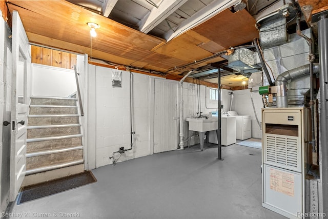 2143 Boldt St, Dearborn, MI 48124 - basement featuring washing machine and clothes dryer, stairway, and a sink