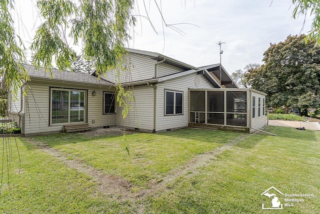 6337 Raymar St, Erie, MI 48133 - rear view of house featuring a sunroom, a yard, and crawl space