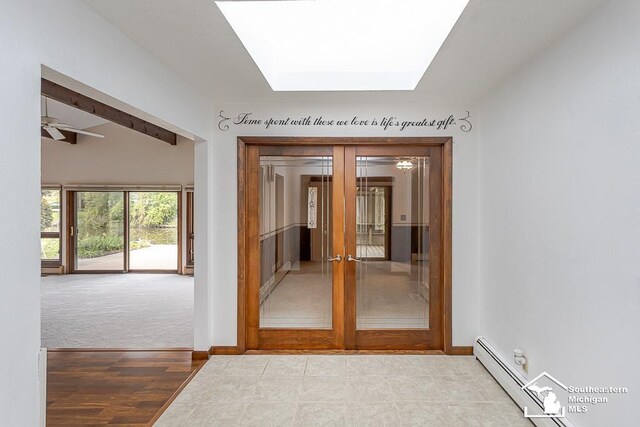 6337 Raymar St, Erie, MI 48133 - hall with french doors, a skylight, and baseboards