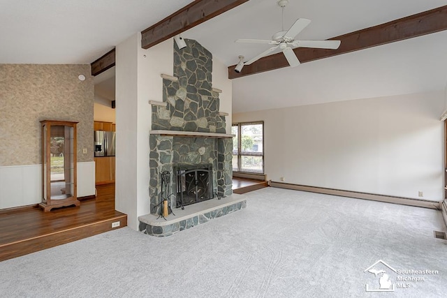 6337 Raymar St, Erie, MI 48133 - unfurnished living room with ceiling fan, beam ceiling, carpet floors, a fireplace, and high vaulted ceiling