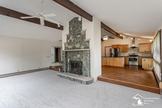 6337 Raymar St, Erie, MI 48133 - unfurnished living room with ceiling fan, a sink, beamed ceiling, dark colored carpet, and a fireplace