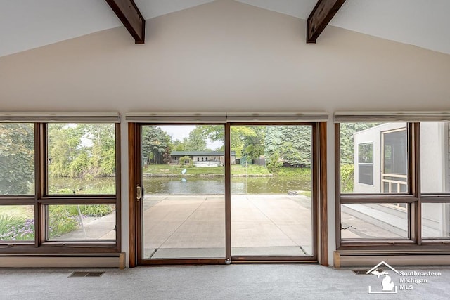 6337 Raymar St, Erie, MI 48133 - doorway with a water view, carpet flooring, beamed ceiling, and high vaulted ceiling