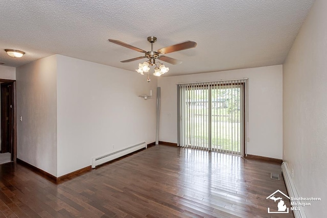 6337 Raymar St, Erie, MI 48133 - unfurnished room featuring a baseboard heating unit, wood finished floors, baseboards, and a textured ceiling