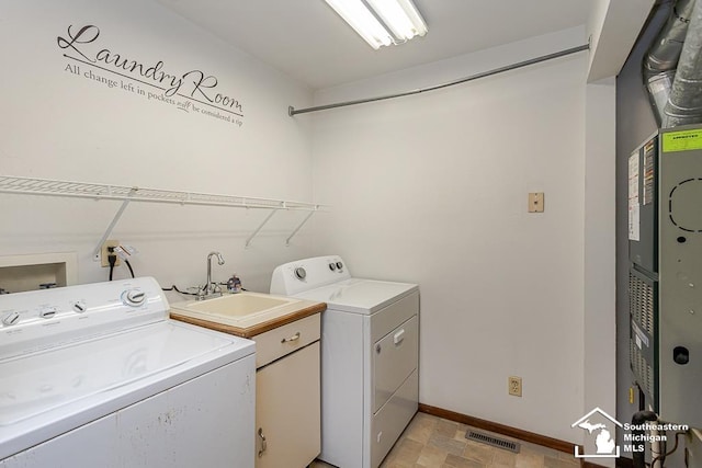 6337 Raymar St, Erie, MI 48133 - laundry area featuring separate washer and dryer, baseboards, and heating unit