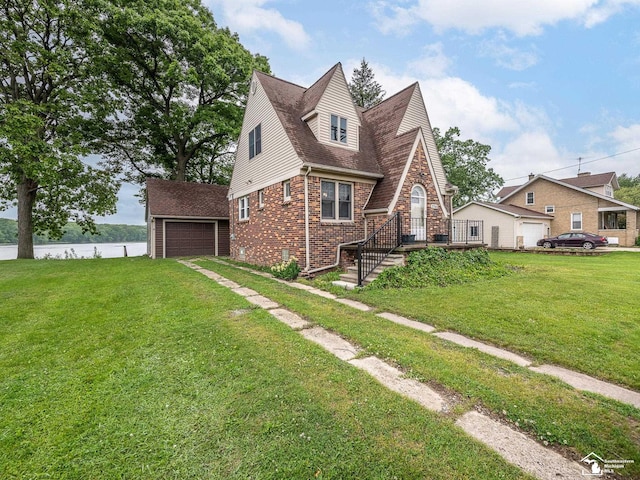 27145 James Ave, Flat Rock, MI 48134 - view of front of house featuring brick siding, a garage, a front yard, and a shingled roof