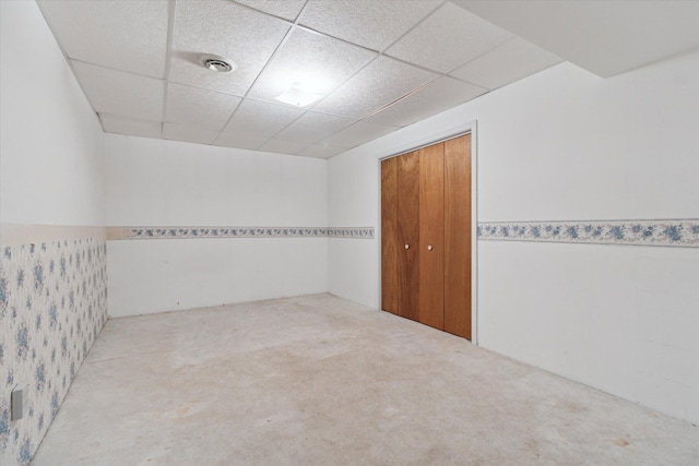 303 E Xy Ave, Vicksburg, MI 49097 - carpeted empty room with a paneled ceiling and wainscoting