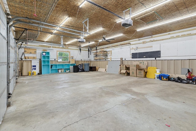 303 E Xy Ave, Vicksburg, MI 49097 - garage featuring a garage door opener