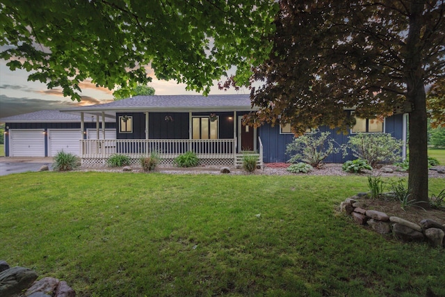 303 E Xy Ave, Vicksburg, MI 49097 - single story home featuring board and batten siding, a front lawn, and an outbuilding