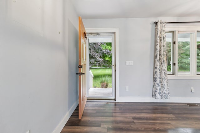 303 E Xy Ave, Vicksburg, MI 49097 - foyer entrance with wood finished floors and baseboards