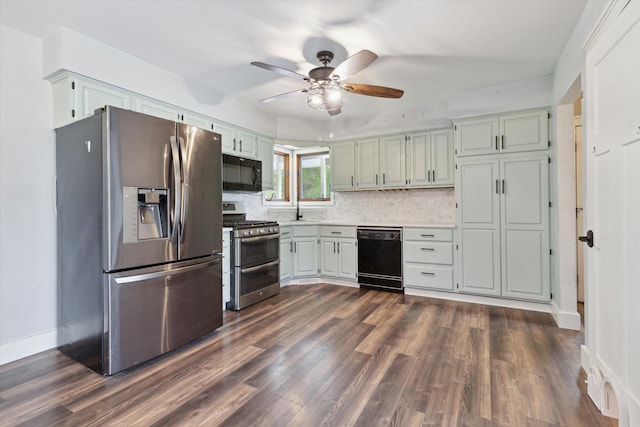 303 E Xy Ave, Vicksburg, MI 49097 - kitchen featuring black appliances, a ceiling fan, light countertops, and dark wood-style flooring