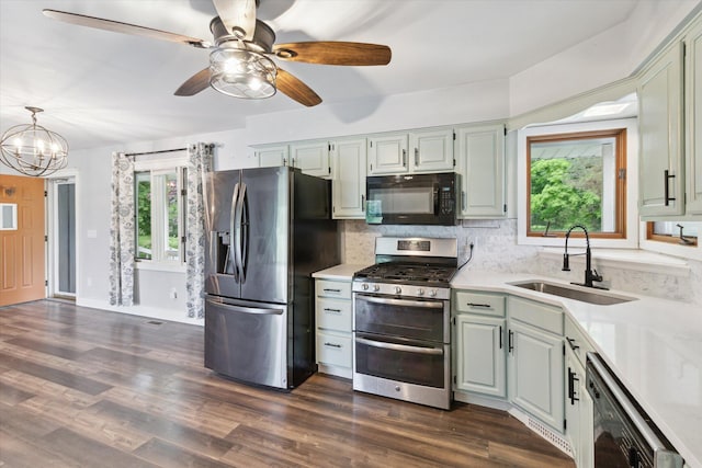 303 E Xy Ave, Vicksburg, MI 49097 - kitchen with stainless steel appliances, a sink, healthy amount of natural light, and light countertops